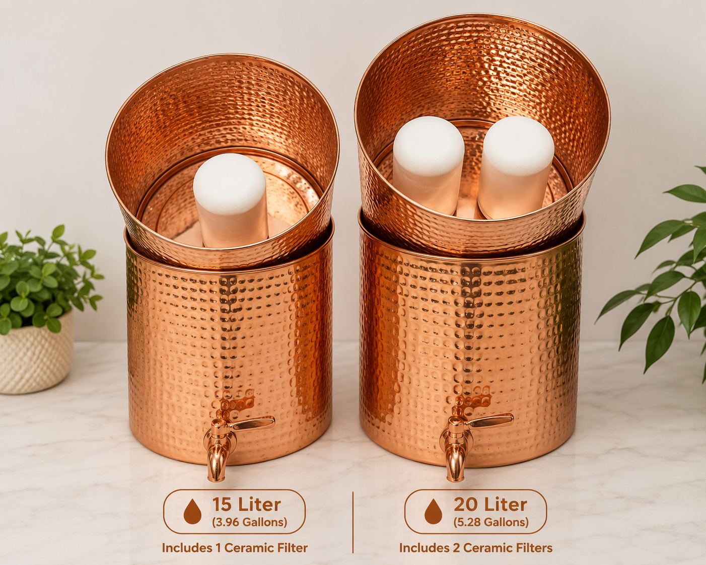 Two hammered copper water filters displayed side by side on a light marble surface with small potted plants. The left unit is labeled 15 Liter and includes 1 ceramic filter, while the right unit is labeled 20 Liter and includes 2 ceramic filters.